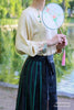 Lady wearing Silk blouse matching the xiangyunsha silk mamianqun skirt 