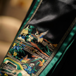 Embroidered fabric with traditional design featuring a crane and landscape.