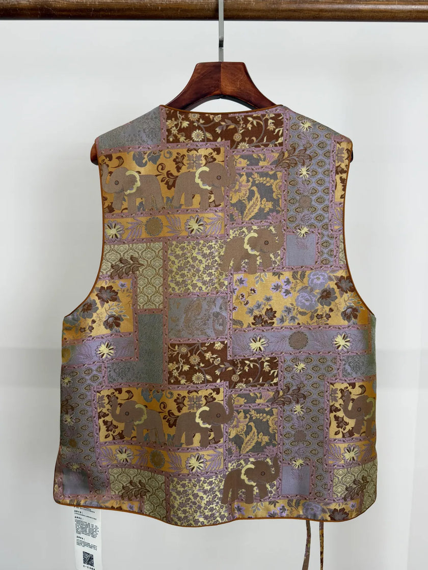 Back view of the brown elephant motif mulberry silk vest from Luxe Orienta