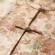 Close-up of the  floral embroidered fabric with tehe frog buttons