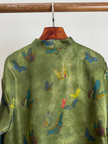 the backside view of the green blouse