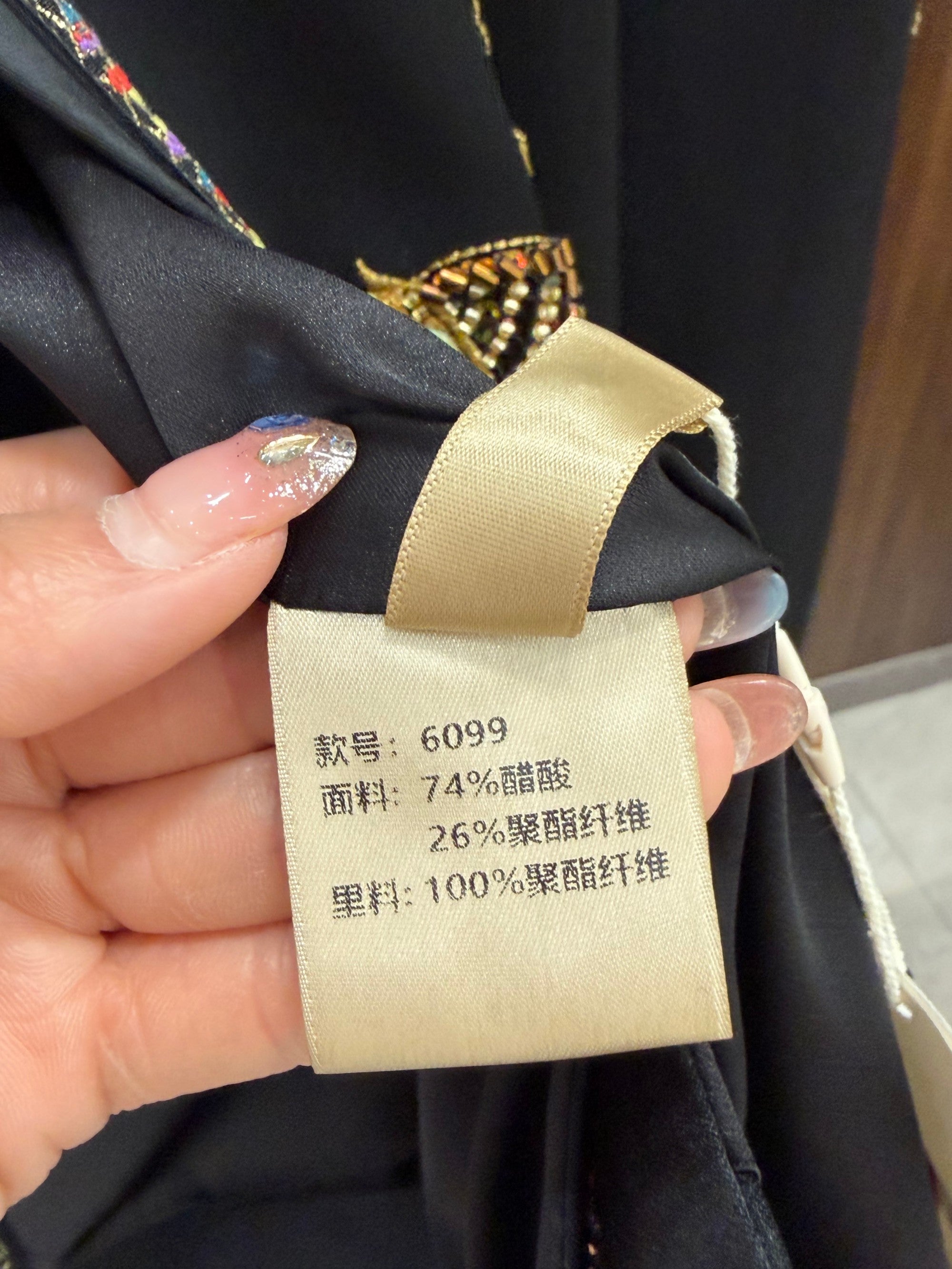 golden chinese embroidered top with horse motif fabric lable