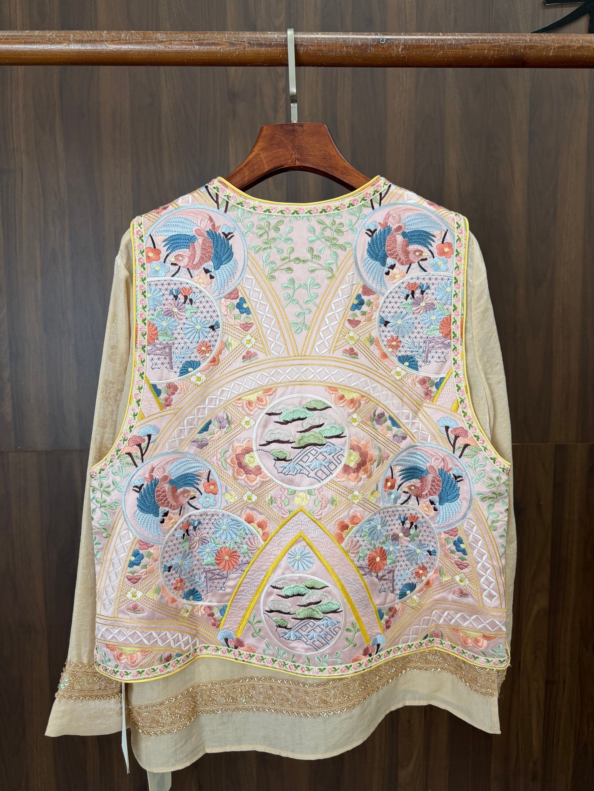 modern oriental fashion outfit styled with pink embroidered vest