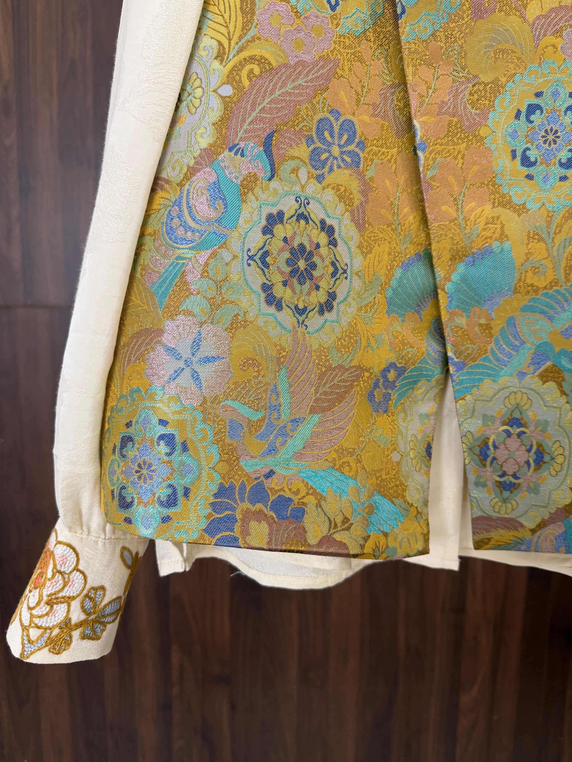 gold enamel jacquard mulberry silk fabric detail with auspicious bird pattern