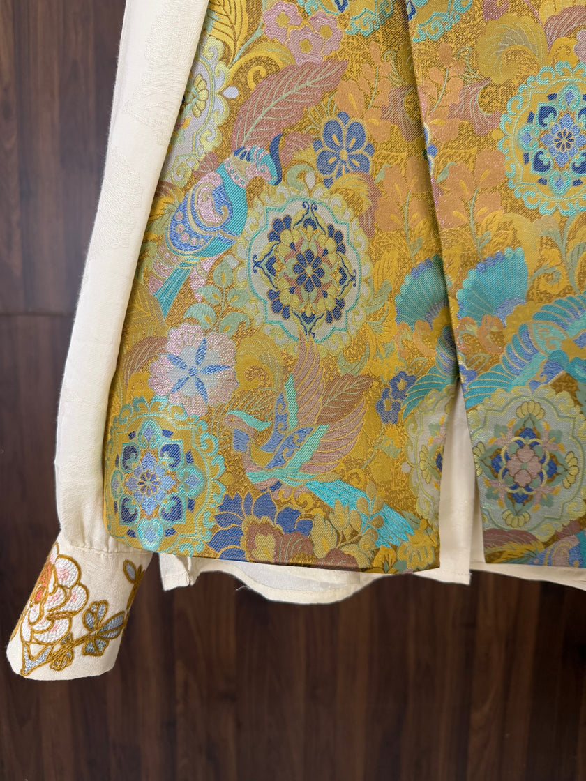 gold enamel jacquard mulberry silk fabric detail with auspicious bird pattern