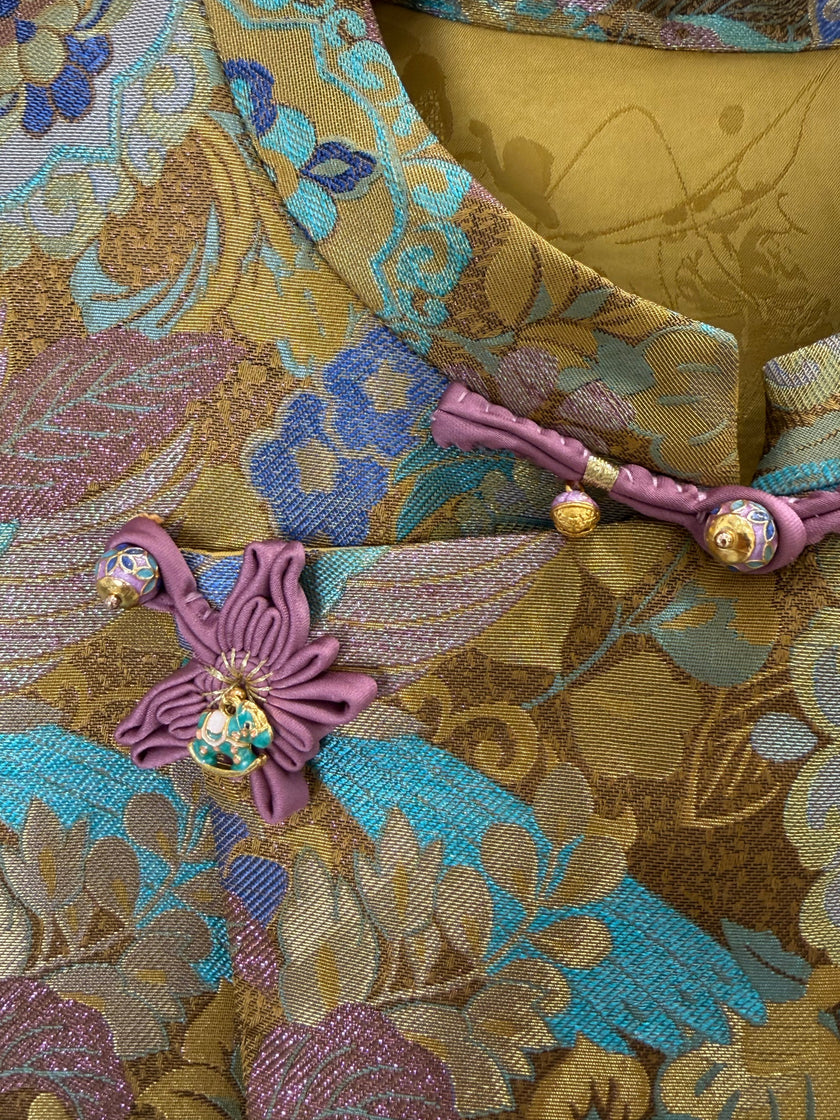 gold enamel jacquard mulberry silk fabric detail with auspicious bird pattern