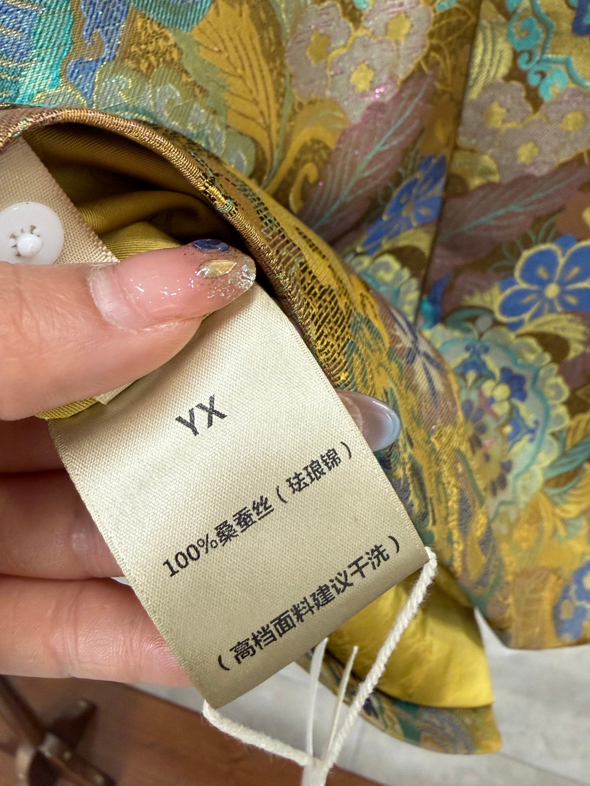 gold enamel jacquard mulberry silk fabric detail with auspicious bird pattern