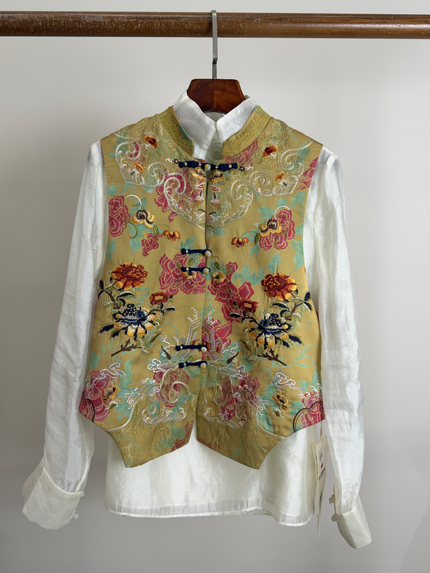Peony embroidered vest over a white shirt 