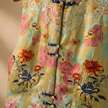 Close-up of a colorful embroidered vest with floral patterns 