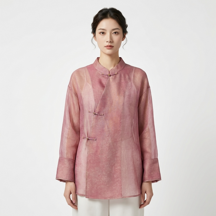 Woman wearing a pink brocadde frog-button blouse front view