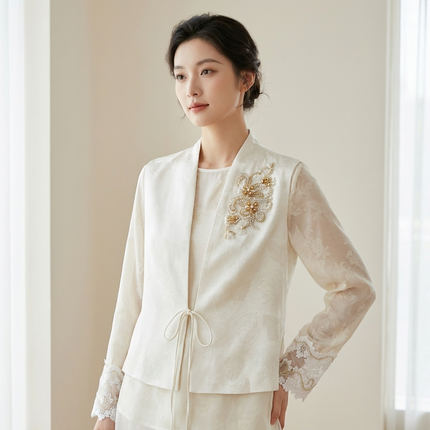 Woman wearing a white embroidered vest with lace sleeves 