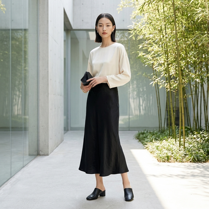 Model Wearing Black Acetate Midi Skirt front view from Luxe Orienta