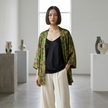 Lady in a Green Xiangyunsha Silk Cardigan with Pomegranate Print Front Look-Luxe Orienta