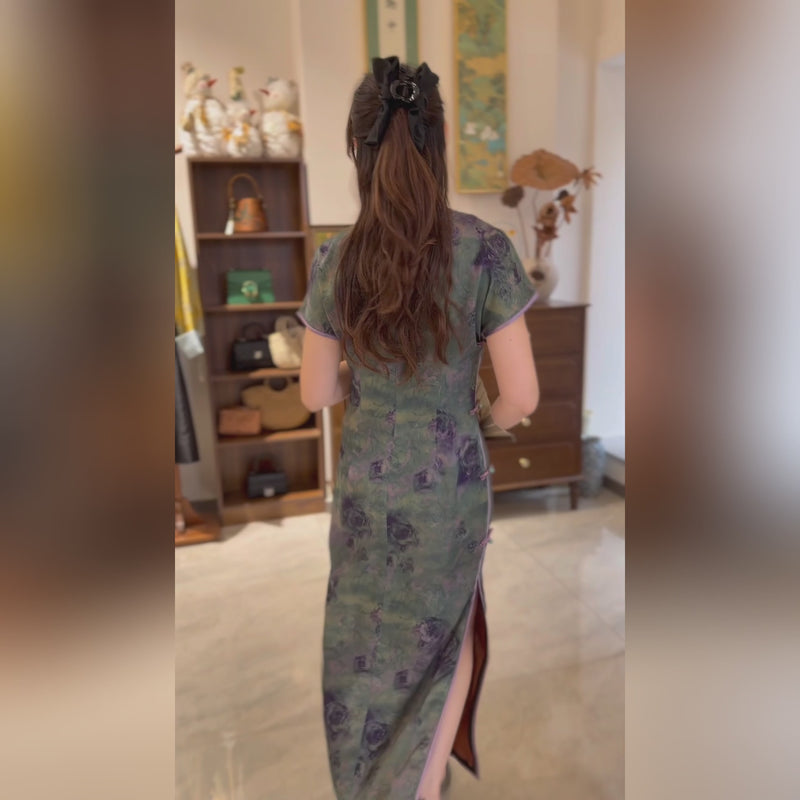 long qipao dres adorned with a gradient of dark green and purple roses