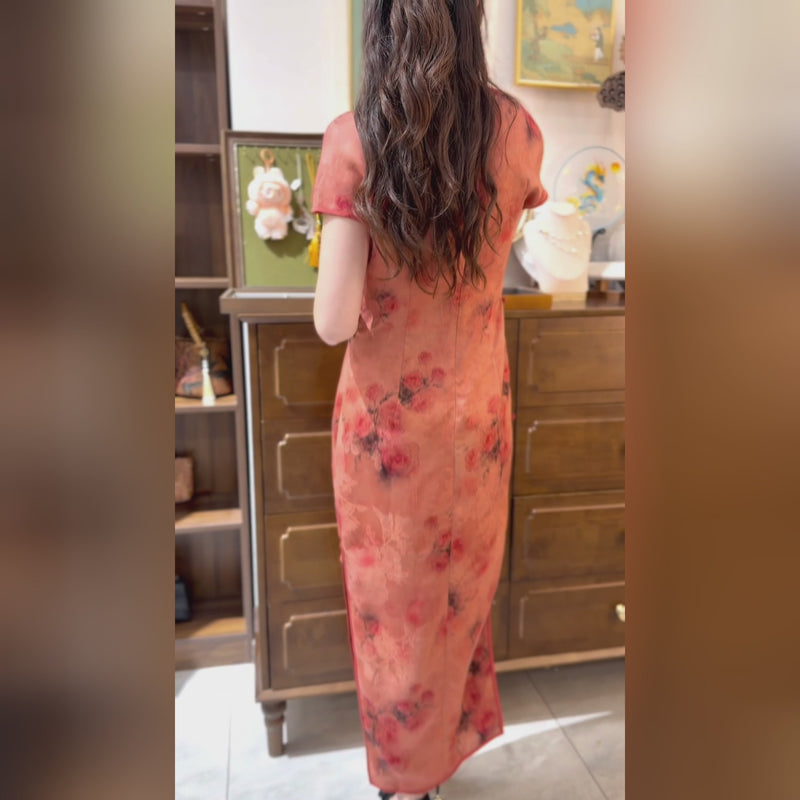 A warm red rose hue adorns the long cheongsam
